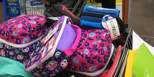 Shopping cart filled with school supplies